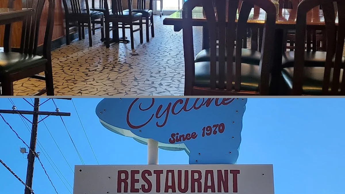 Restaurant interior with tables and simple decor.